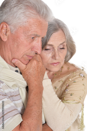 Close up portrait of sad senior couple
