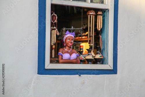 Namoradeira is a woman looking at street waiting in the window a boyfriend arrived, Brazilian handicraft made with adobe and a colonial traditional sculpture. Pirenópolis, Goiás, Brazil.