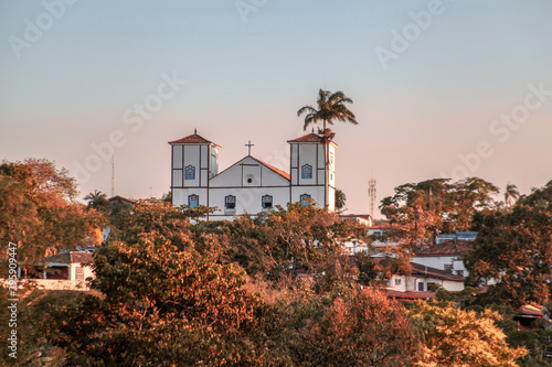 Pirenopolis, Goias, Brazil, October 18, 2019: The landscape at the end of the day and the towers of Nossa Senhora do Rosário Church in the historic center of Pirenopolis photo