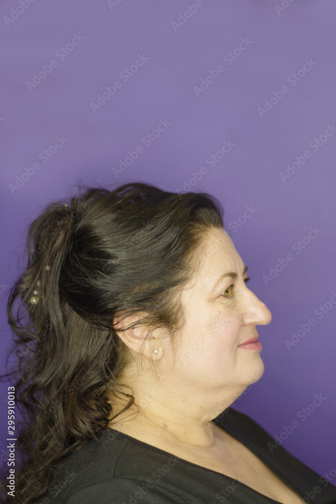 Middleaged woman with long brown hair and curly Middleaged woman with long brown hair and curly