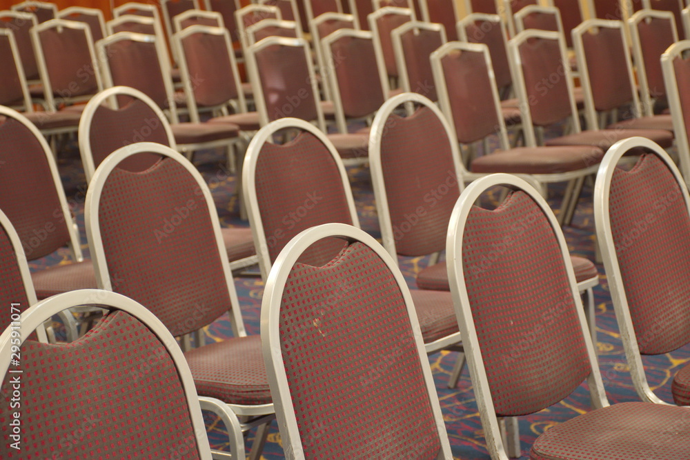 Fototapeta premium Group of brown chairs in rows