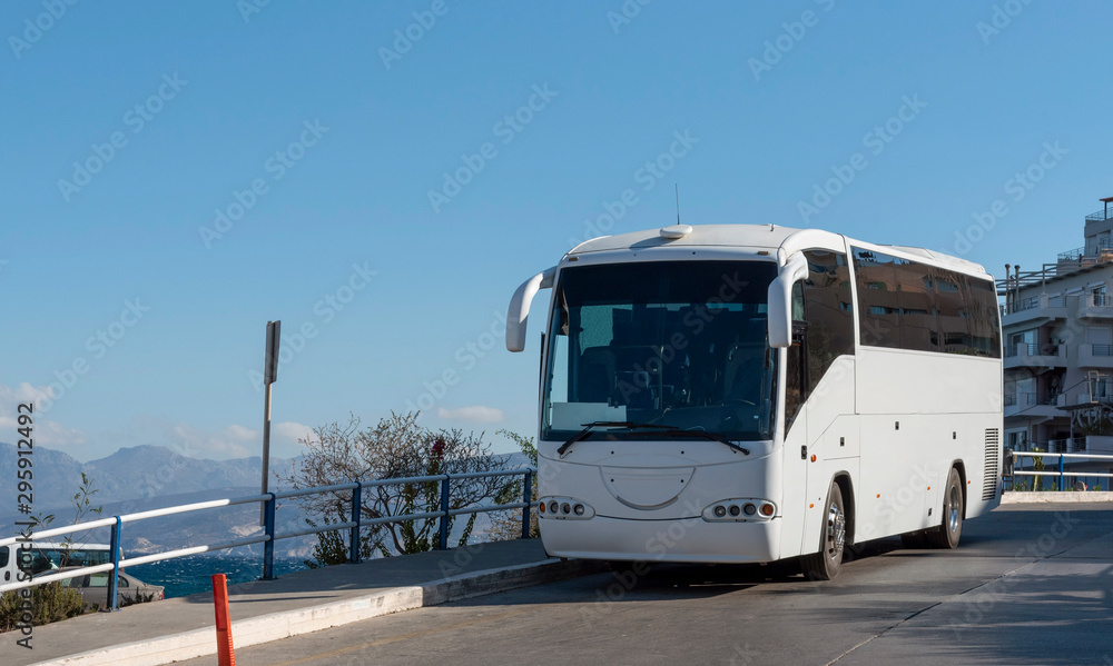Agios Nikolaus, Crete, Greece. October 2019. An empty tour bus parked on the roadside
