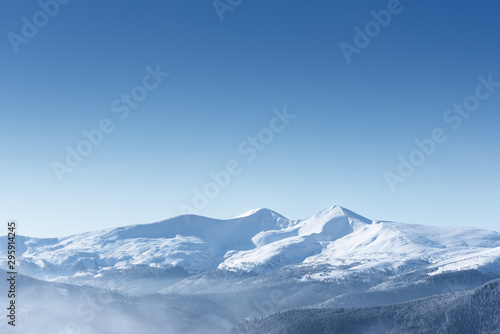 Snow capped mountain peaks © Oleksandr Kotenko