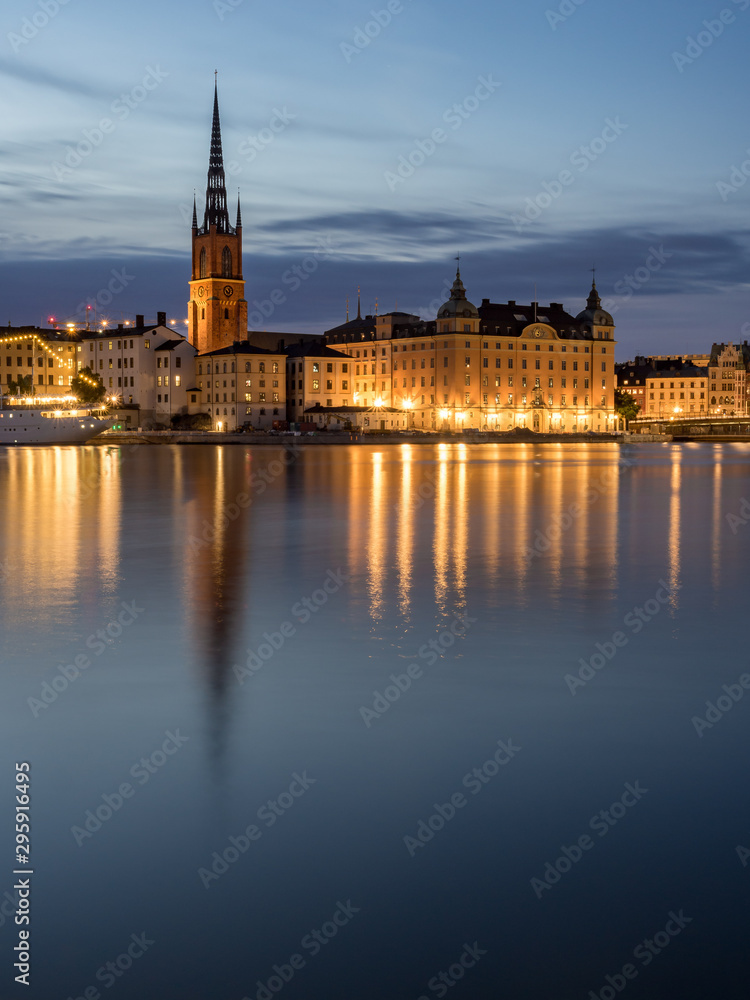 Beautiful old buildings reflect in the water in Stockholm, Sweden.