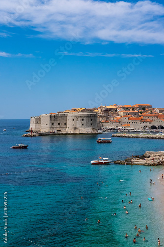 Fototapeta Naklejka Na Ścianę i Meble -  Old city walls in historic Dubrovnik city, Dalmatia, Croatia, emerald Adriatic Sea and blue summer sky, popular touristic destination