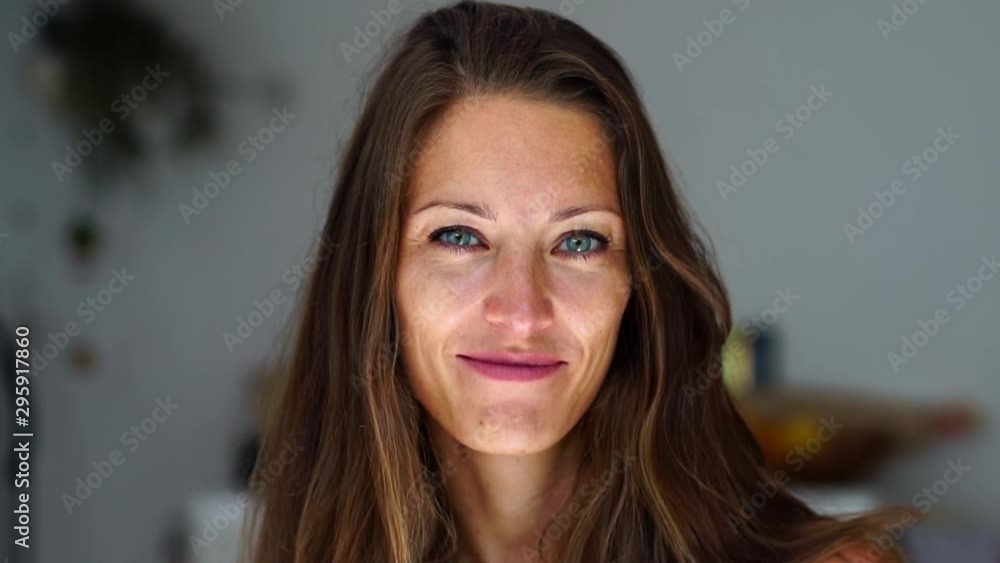 Attractive young business woman smiling. Concept of friendly female in entrepreneur tech startup work from home. Slow motion portrait. Attractive young business woman smiling. Concept of friendly female in entrepreneur tech startup work from home. Slow motion portrait.