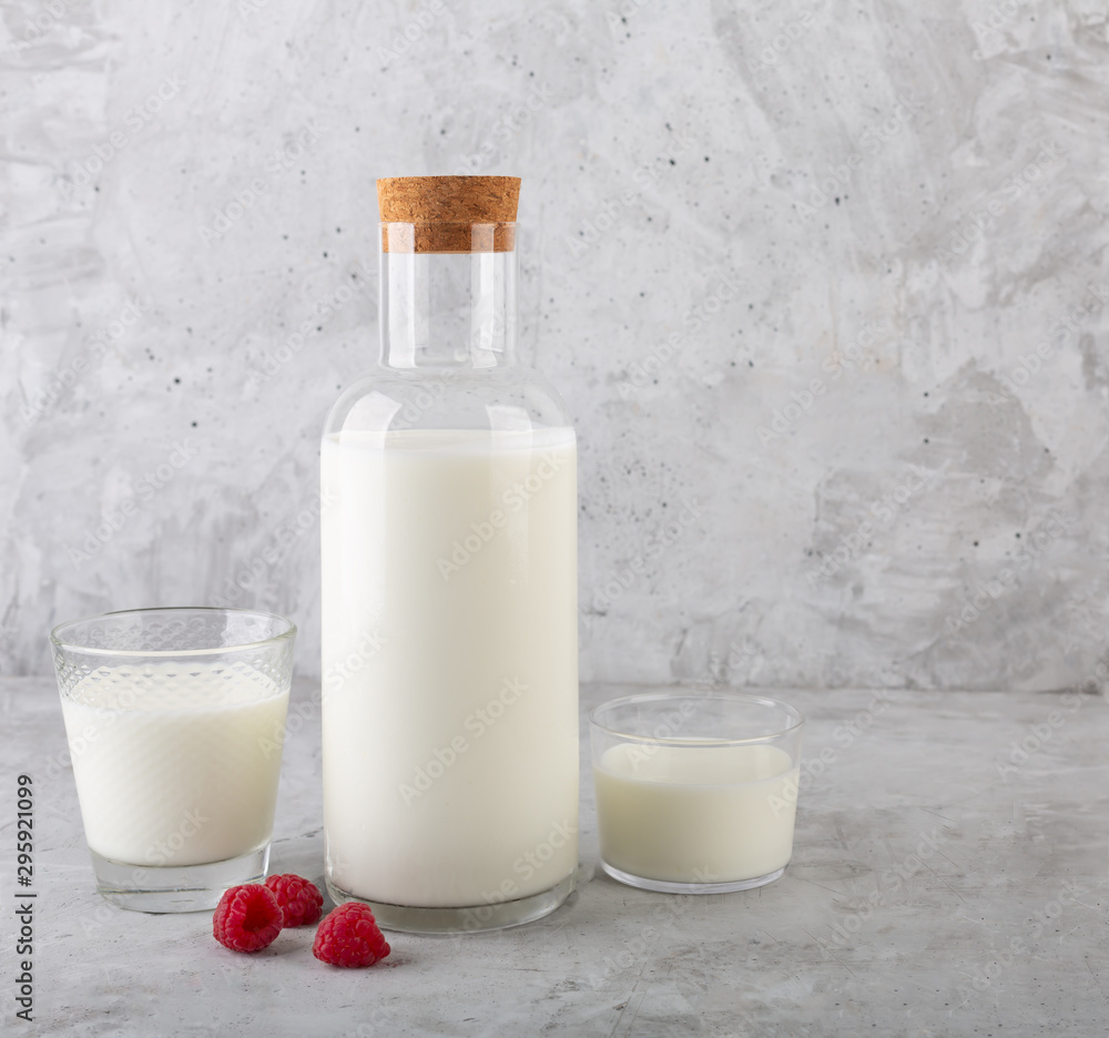 Kefir drink with raspberry on the gray background Kefir drink with raspberry on the gray background