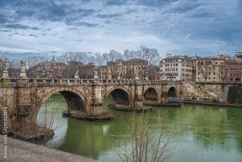 Sant'angelo bridge over the Tiber river in Rome on a cloudy winter day