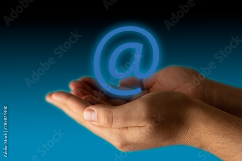 Two hands holding mail symbol