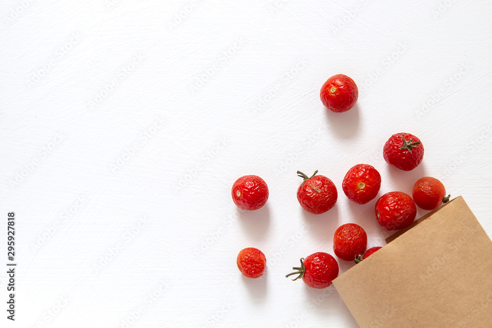 Shriveled cherry tomatoes on a white background Shriveled cherry tomatoes on a white background