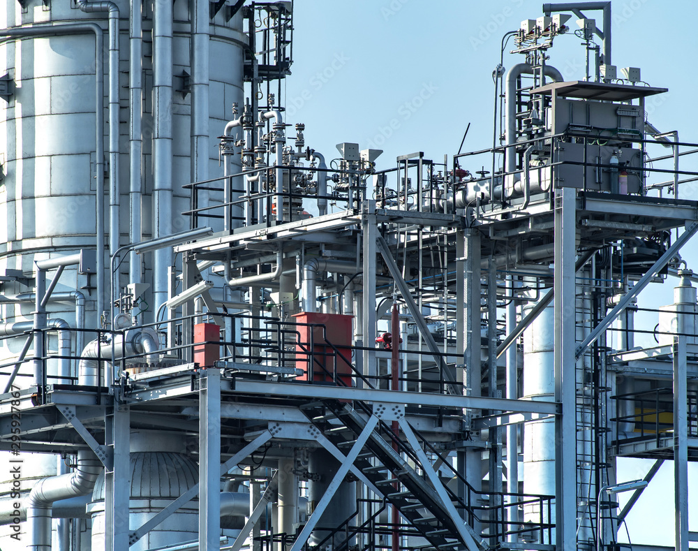 Oil and gas industrial refinery zone,Detail of equipment oil pipeline steel with valve from large oil storage tank 