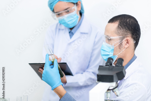 scientist with equipment an...