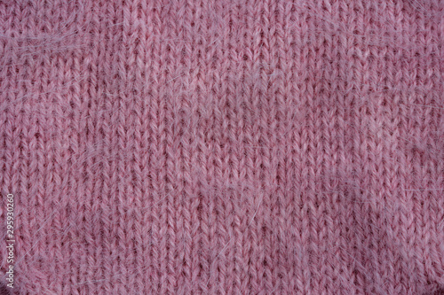 Knitted warm pink winter sweater. Huggy style.
