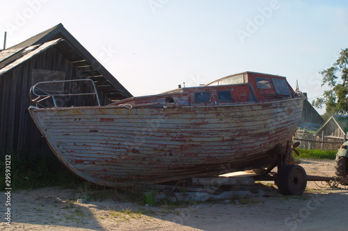 Image of an Old Longboat on a trailer for transportation. Solovki. Russia
