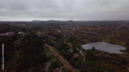 Aerial flying over Sørlandet Line rails and the rocky landscape in Egersund, Norway photo