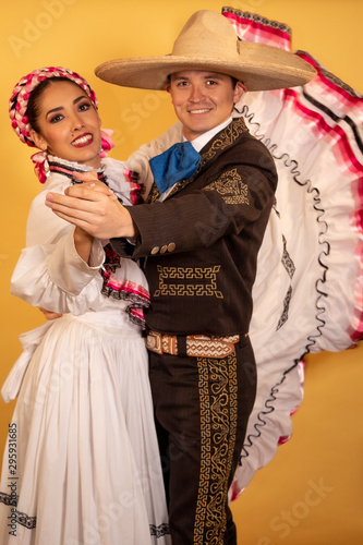 Charro and Adelita dancing young couple portrait in love folk culture  photo