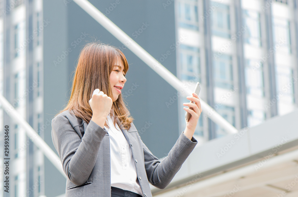 Fototapeta premium Business women looking phone She is smiling and happy