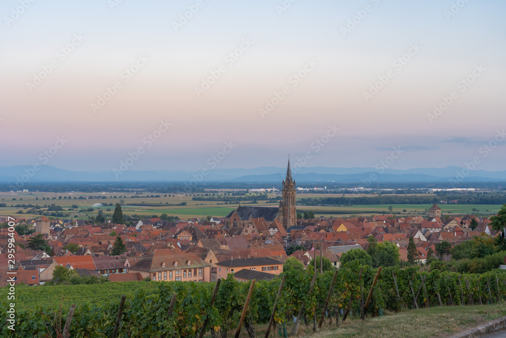 Dambach-La-Ville, France - 09 15 2019: Panoramic view of the vineyards and the village at sunset.