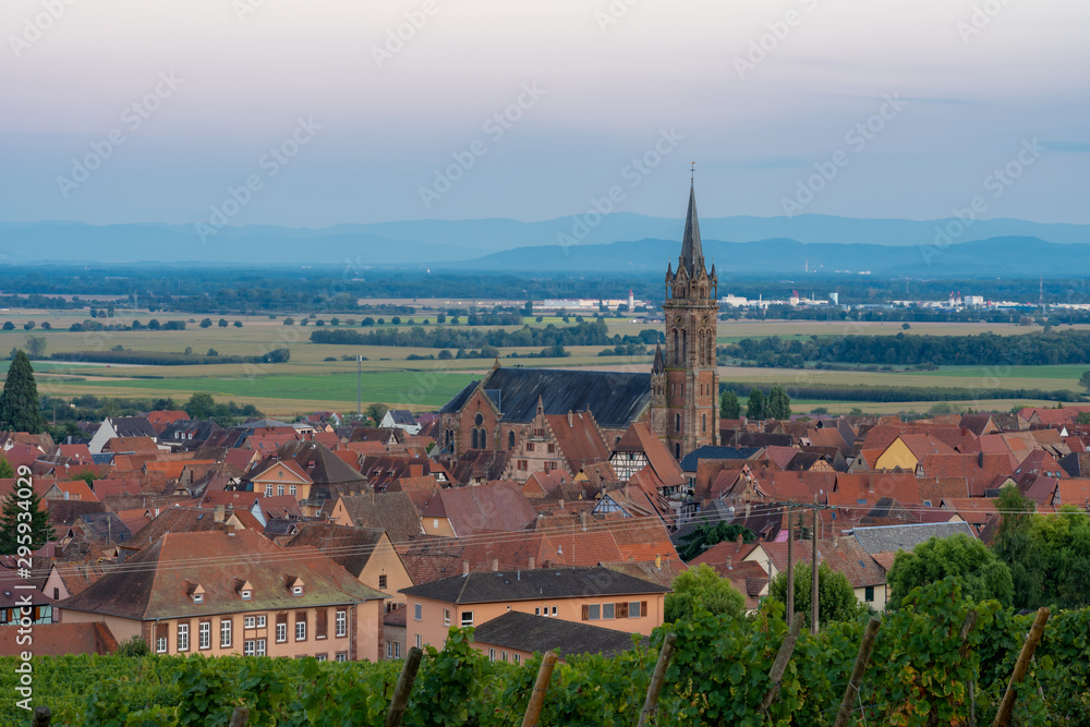 Dambach-La-Ville, France - 09 15 2019: Panoramic view of the vineyards and the village at sunset.