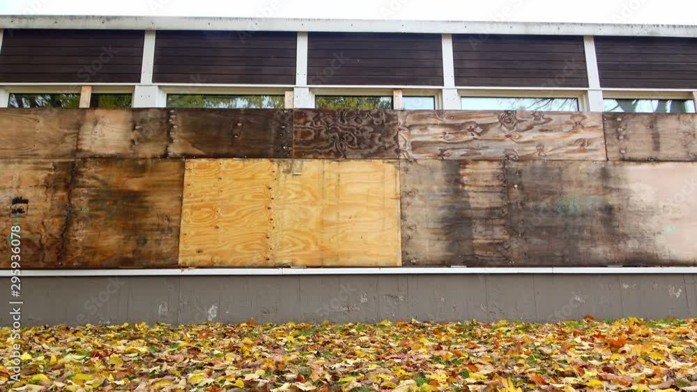 Old building windows covered with plywood Old building windows covered with plywood