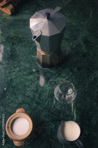 Flat lay of preparing coffee on green marble table