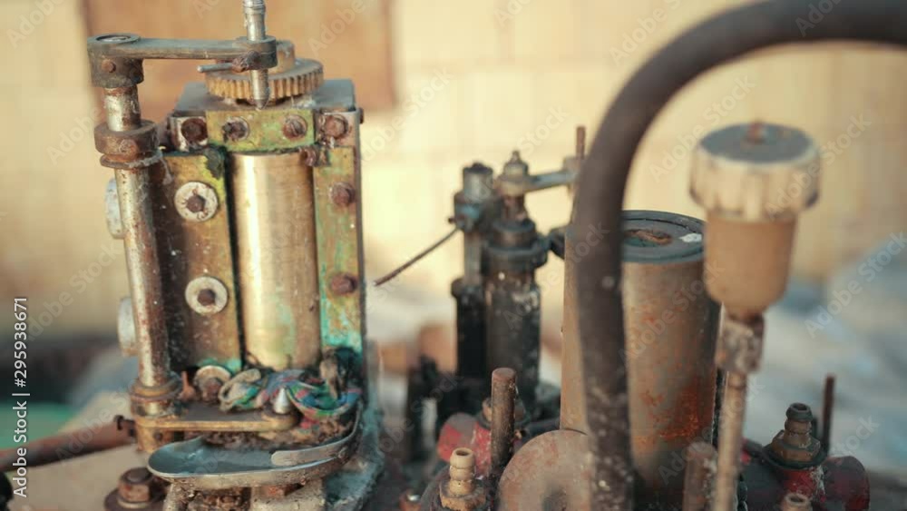 many old scrap, faulty, rusted mechanism, old machine from the factory, gears, which are a lot of rubber belts, slow motion, close up many old scrap, faulty, rusted mechanism, old machine from the factory, gears, which are a lot of rubber belts, slow motion, close up