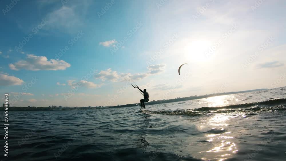 Person doing kite surfing on water. Person doing kite surfing on water.