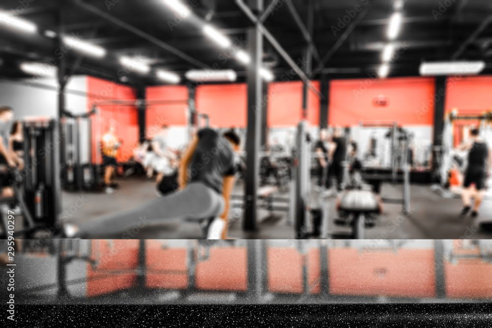 Fototapeta premium Dumbbell, barbell and workout in the gym. Copy space with blurred gym background.