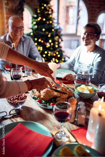 Canvastavla Family and friends dining at home celebrating christmas eve with traditional foo