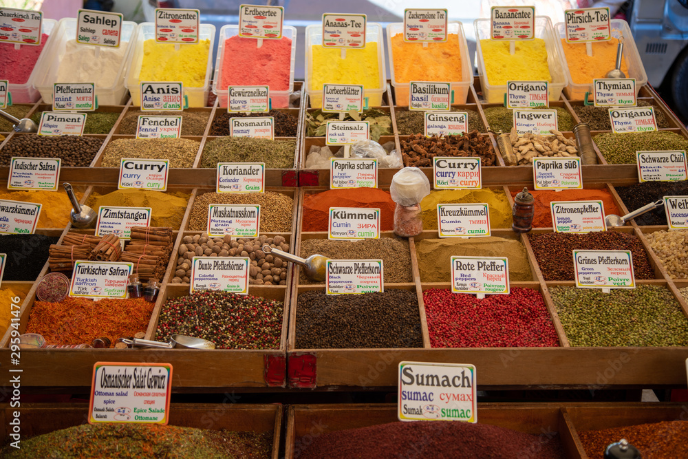 many vessels filled with spices in various colors are offered from an oriental bazaar many vessels filled with spices in various colors are offered from an oriental bazaar