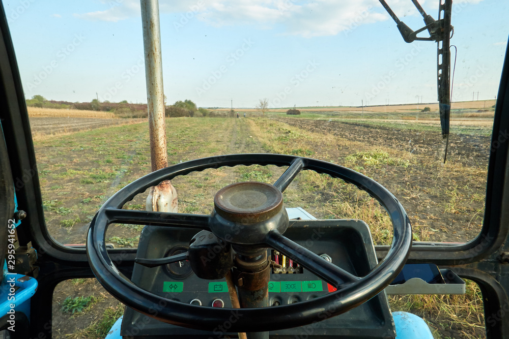 view from tractor cab on field