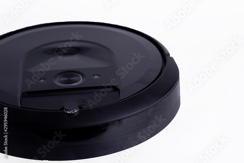 Robotic vacuum cleaner isolated on white background. New technology concept.