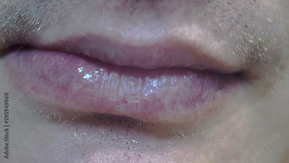 adult man's mouth curled into a grimace.close-up adult man's mouth curled into a grimace.close-up