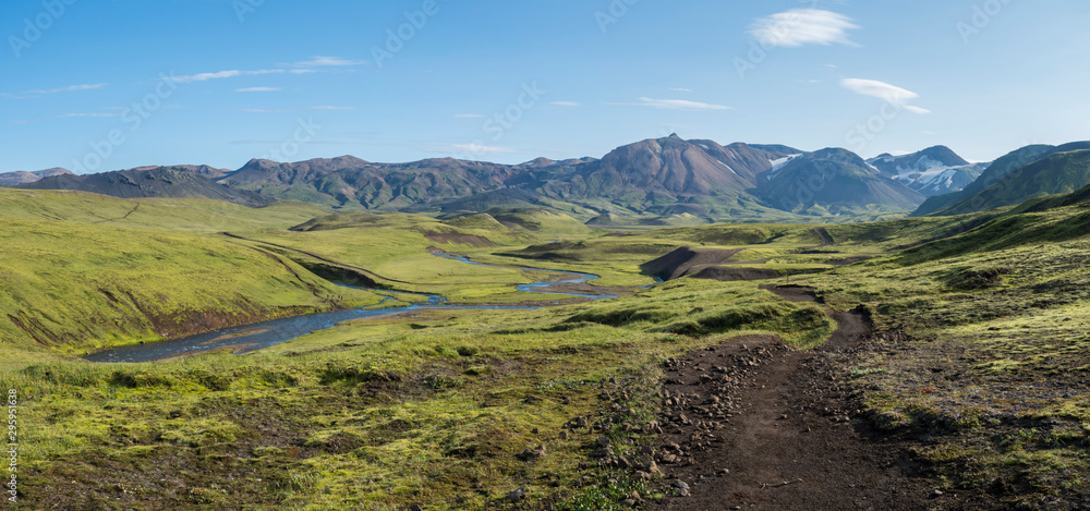 Panoramic landscape with blue river stream, green hills, snow-capped mountains, meadow and lush moss. Laugavegur hiking trail. with Fjallabak Nature Reserve, Iceland. Summer blue sky - obrazy, fototapety, plakaty 