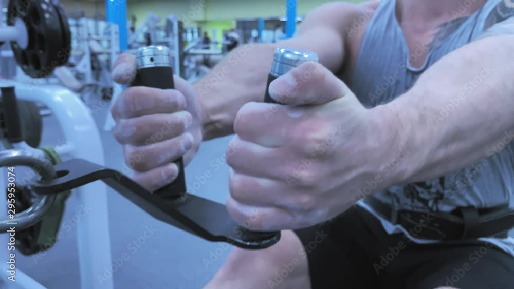 Slow motion. Strong caucasian trains biceps of hand in a fashionable modern gym. Male bodybuilder. Healthy lifestyle. Tattoo. Live camera. Handsome Muscular Man. Close up. 4K UHD Stock footage Slow motion. Strong caucasian trains biceps of hand in a fashionable modern gym. Male bodybuilder. Healthy lifestyle. Tattoo. Live camera. Handsome Muscular Man. Close up. 4K UHD Stock footage