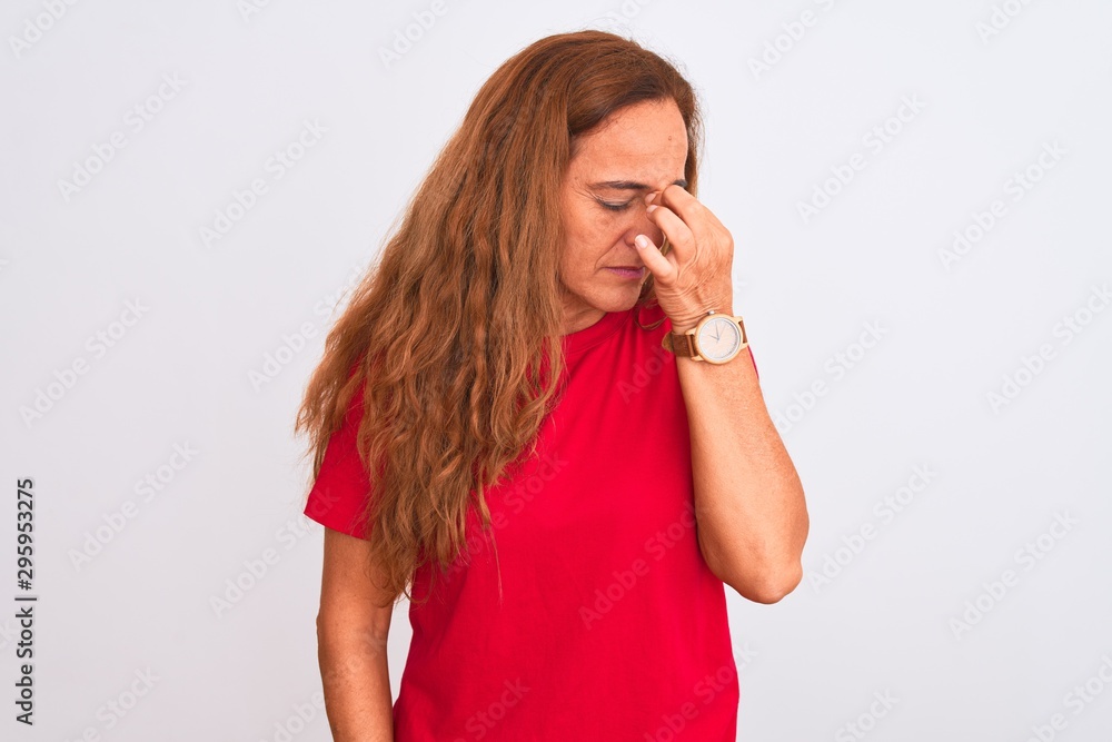 Middle age mature woman standing over white isolated background tired rubbing nose and eyes feeling fatigue and headache. Stress and frustration concept. Middle age mature woman standing over white isolated background tired rubbing nose and eyes feeling fatigue and headache. Stress and frustration concept.