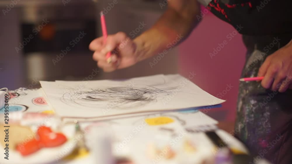 Student makes drawing with a simple pencil on paper. Student makes drawing with a simple pencil on paper.