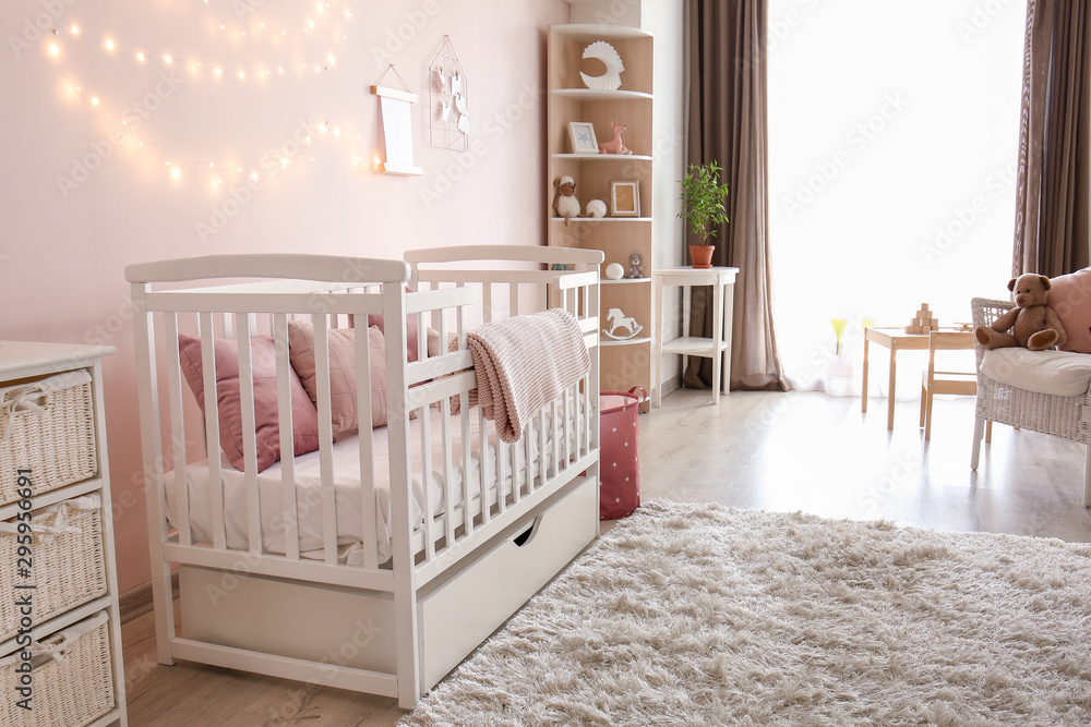 Interior of stylish children's room with baby bed Interior of stylish children's room with baby bed