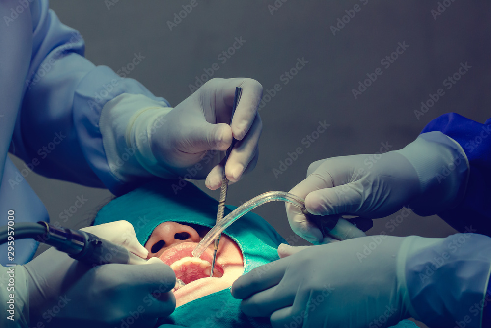 Medical dentist procedure of teeth polishing. Dentistry and healthcare concept . Dentist with mouth mirror and probe checking for kid patient teeth at dental clinic. Medical dentist procedure of teeth polishing. Dentistry and healthcare concept . Dentist with mouth mirror and probe checking for kid patient teeth at dental clinic.