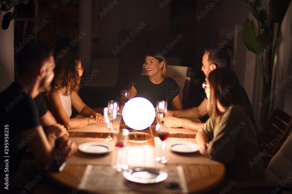 Beautiful family on dinner talking and smiling at terrace Beautiful family on dinner talking and smiling at terrace