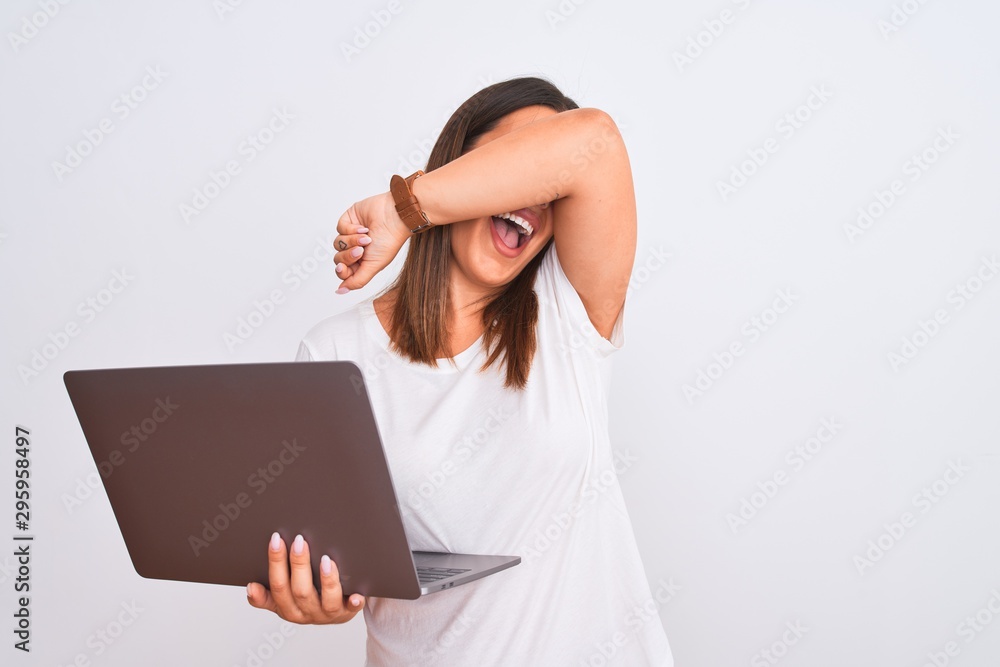 Beautiful young woman working using computer laptop over white background Smiling cheerful playing peek a boo with hands showing face. Surprised and exited Beautiful young woman working using computer laptop over white background Smiling cheerful playing peek a boo with hands showing face. Surprised and exited