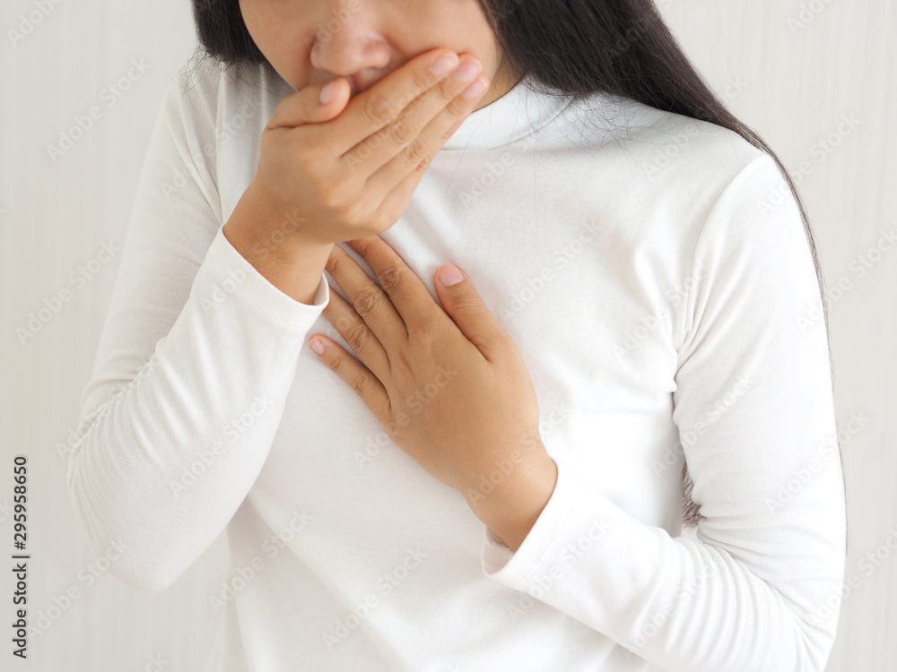 woman vomiting and nausea on isolated white background use for health care concept. woman vomiting and nausea on isolated white background use for health care concept.