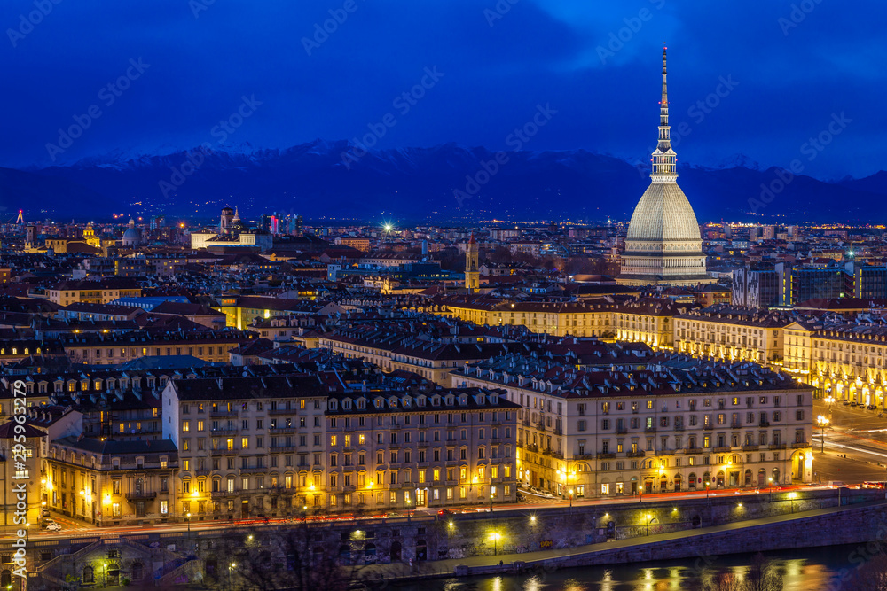 Panoramic view of Turin with Mole Antonelliana and snow capped Alps, Turin at dust, Italy