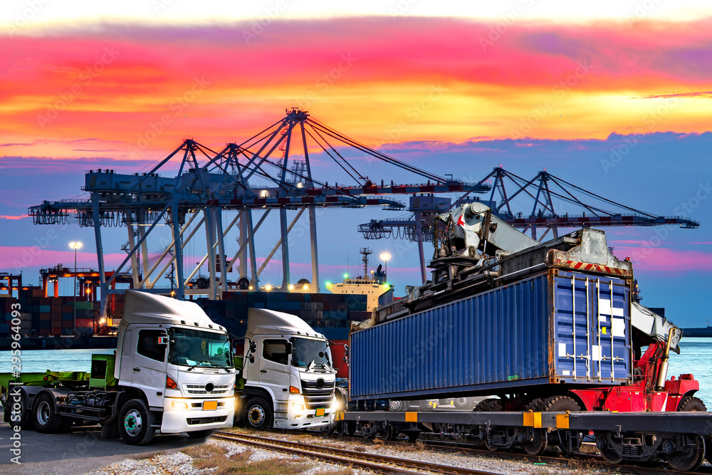 The cargo ship industry is parked in a harbor with a large crane bridge, transporting goods, importing and exporting trucks The cargo ship industry is parked in a harbor with a large crane bridge, transporting goods, importing and exporting trucks