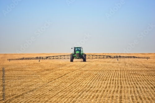 Obraz na plátne tractor working in field spraying