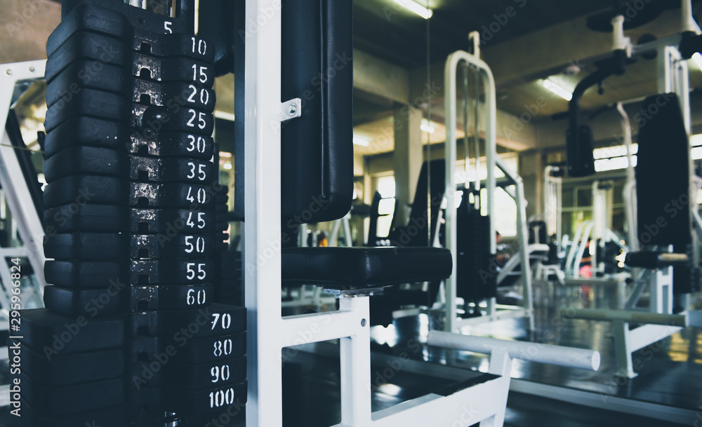 Dumbbells in many sizes, weights Set for exercising in the fitness center, exercise concept, health concept, close-up images. Dumbbells in many sizes, weights Set for exercising in the fitness center, exercise concept, health concept, close-up images.