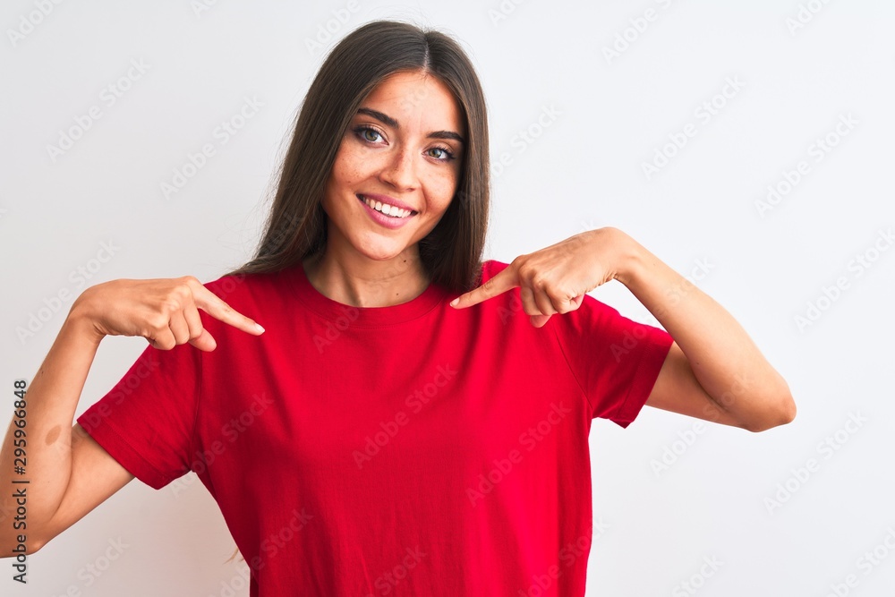 Young beautiful woman wearing red casual t-shirt standing over isolated white background looking confident with smile on face, pointing oneself with fingers proud and happy. Young beautiful woman wearing red casual t-shirt standing over isolated white background looking confident with smile on face, pointing oneself with fingers proud and happy.