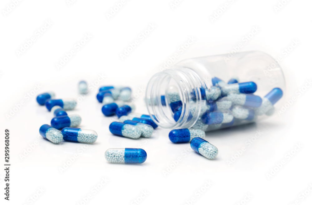 Pile of spilled capsules on a white background Pile of spilled capsules on a white background