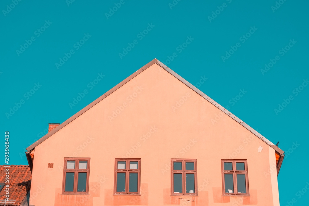 Old House with Windows against clear, blue sky. Minimal Aesthetics.