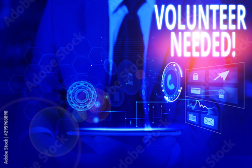 Writing note showing Volunteer Needed. Business concept for asking demonstrating to work for organization without being paid Male wear formal suit presenting presentation smart device